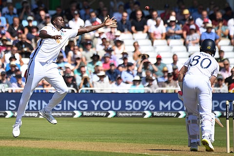 Jason Holder attempts catch the ball 
